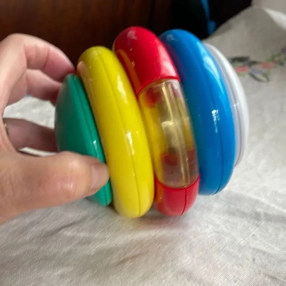 1996, Ring ‘n Roll Gerber Products Co. Toy Biz, Inc roundish rolling rattle infa